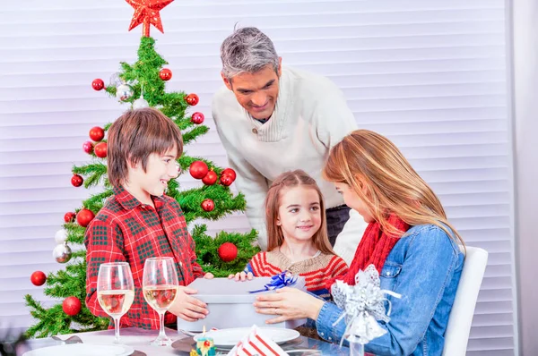 Holidays and celebration concept - Happy family at home celebrat