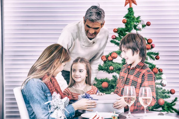 Holidays and celebration concept - Happy family at home celebrat