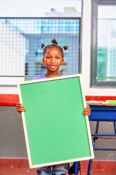 African Girl Primary Elementary School Holding Green Chalkboard — Stock Photo, Image