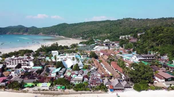 Panoramic aerial view of Tonsai Pier and Phi Phi Don coastline at sunset, Thailand. Slow motion — Stock Video