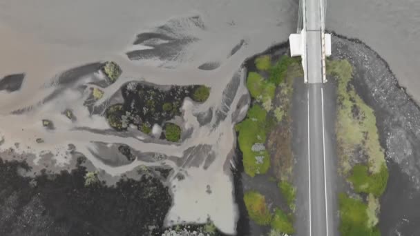 Aerial view of river and bridge in Iceland on a overcast summer day — Stock Video