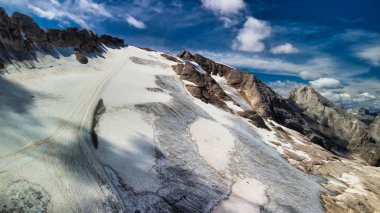 Aerial view of Marmolada Glacier from drone in summer season, Dolomite Mountains. clipart