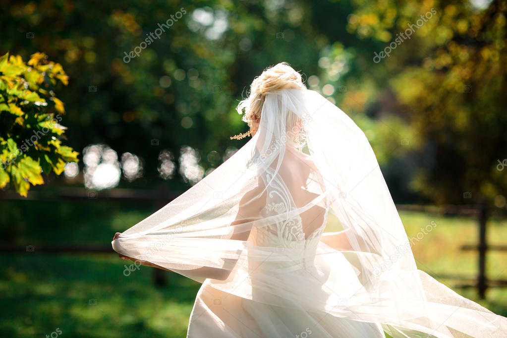 beautiful bride walks at sunset. lifestyle portrait