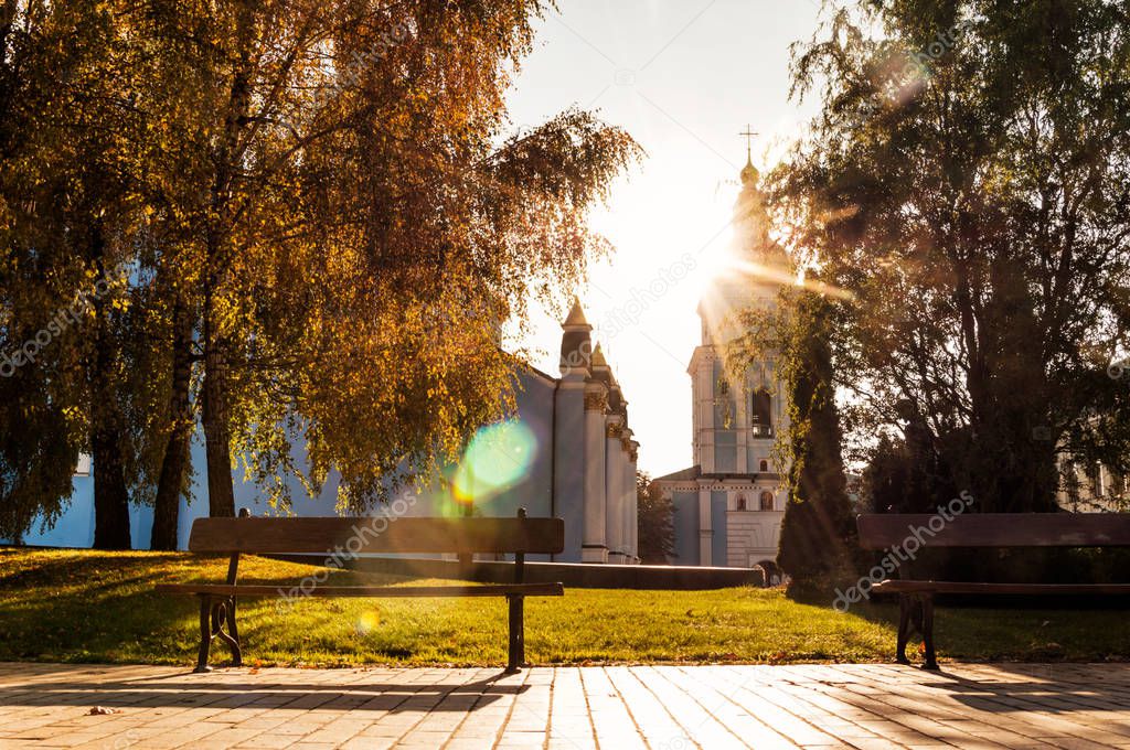 picturesque view of Saint Michael Golden-Domed Monastery with park at autumn sunny day, Kiev, Ukraine 