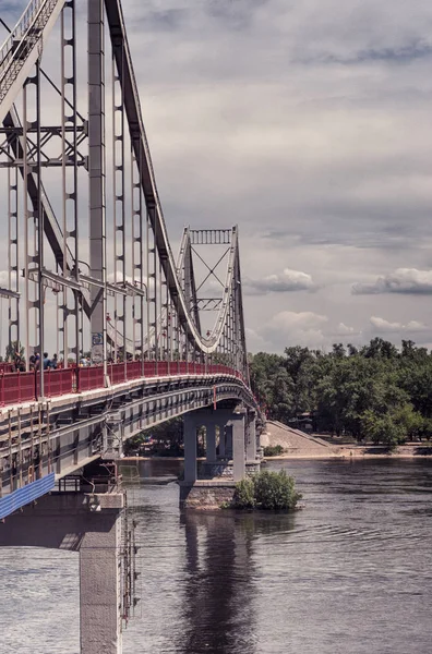 view of pedestrian bridge across Dnieper River to Trukhanov island, Kiev, Ukraine