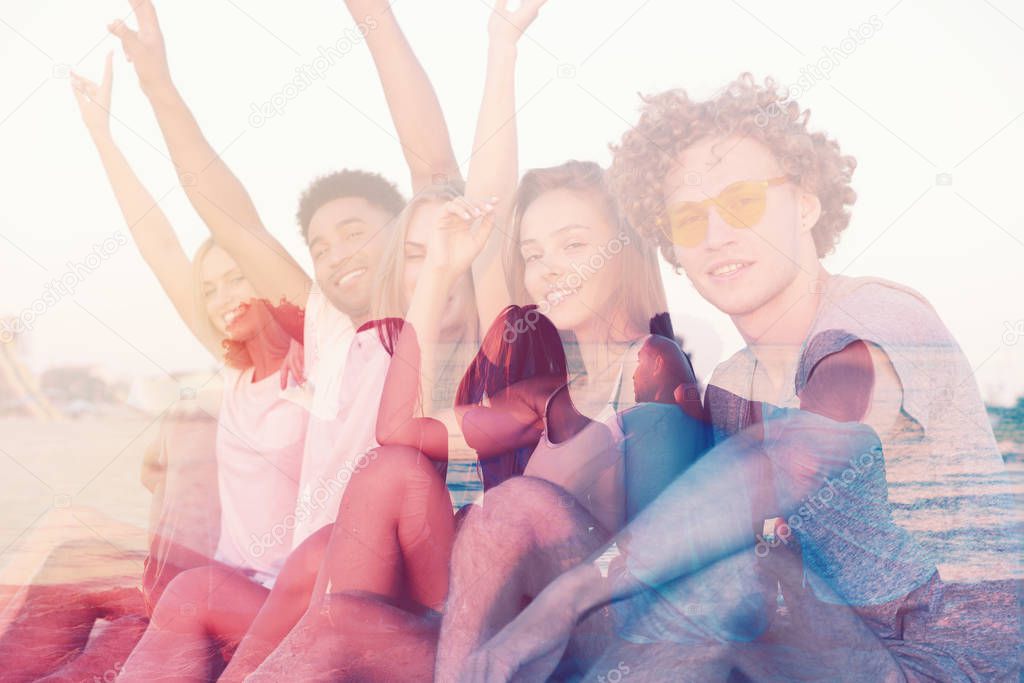 Group of happy friends having fun at ocean beach. double exposure