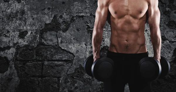 Athletic man training biceps at the gym — Stock Photo, Image