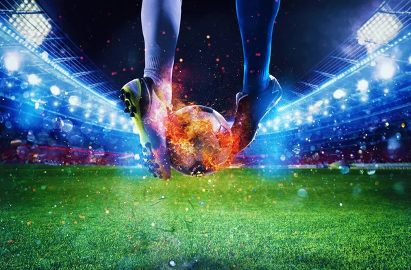 Soccer players with soccerball on fire at the stadium during the match — Stock Photo, Image