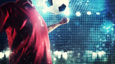 Forvet oyuncu topu futbol gol yakınındaki kontrol eder.