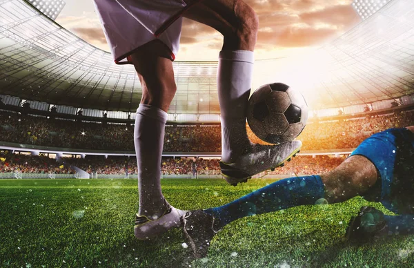 Soccer players with soccerball at the stadium during the match