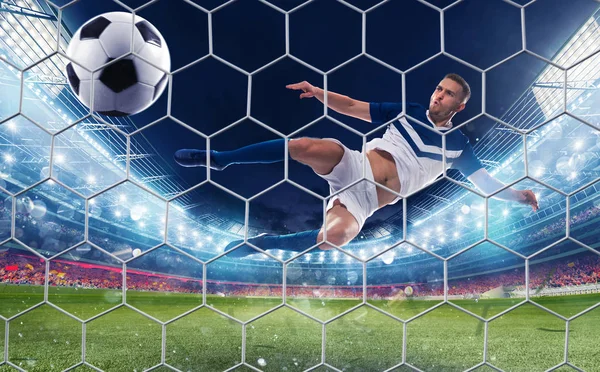 Soccer striker hits the ball with an jumping kick — Stock Photo, Image