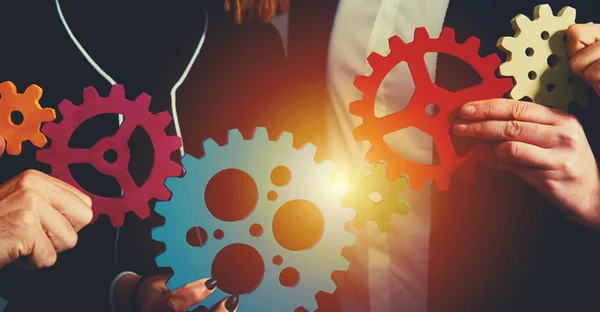 Business team connect pieces of gears. Teamwork, partnership and integration concept — Stock Photo, Image