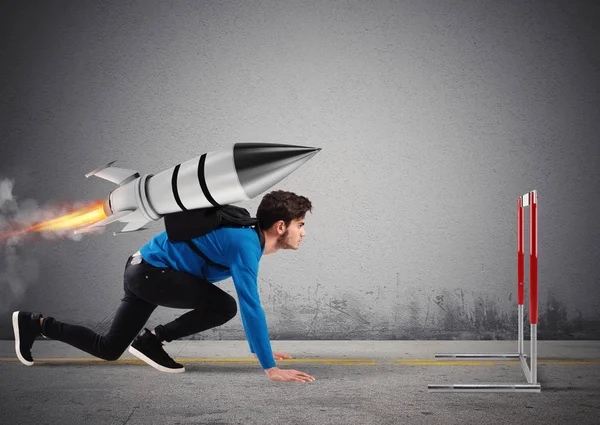 Student overcomes obstacles of his studies at top speed with a rocket — Stock Photo, Image