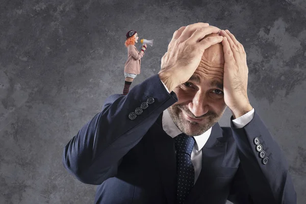 Clown that shuts with megaphone to a businessman — Stock Photo, Image