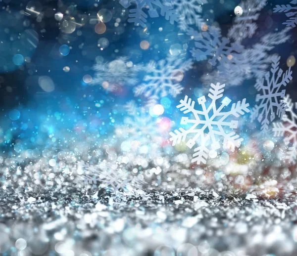 Abstrakte glühende Weihnachten blauen Hintergrund mit Schneeflocken — Stockfoto