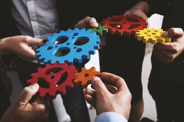 Business team connect pieces of gears. Teamwork, partnership and integration concept — Stock Photo, Image
