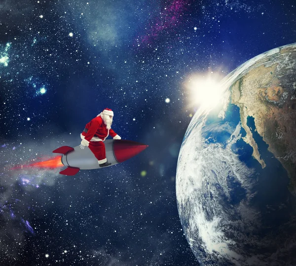 Fast delivery of Christmas gifts with Santa Claus in the space — Stock Photo, Image