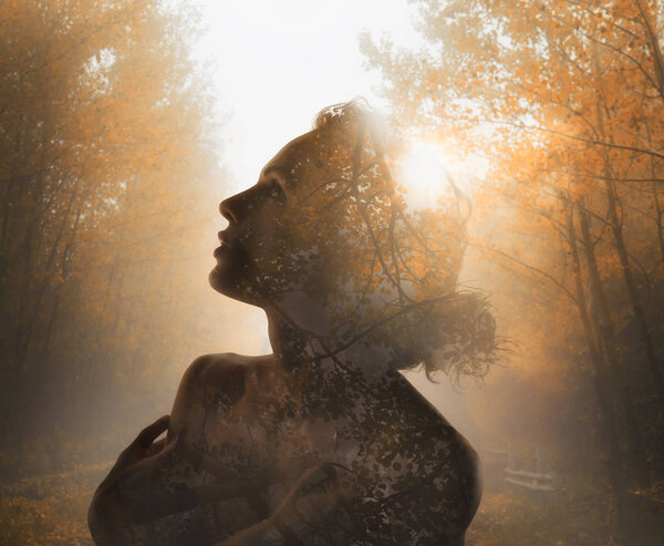 Girl with tree forest inside. Concept of autumn. Double exposure