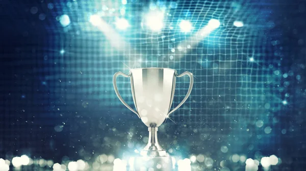 Silver winner s cup in the spotlight with soccer net background — Stock Photo, Image