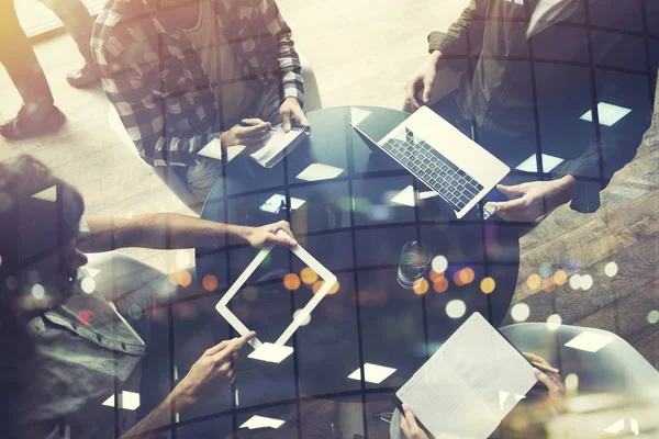 Business people work together with laptop and tablet. Concept of teamwork and startup. Double exposure
