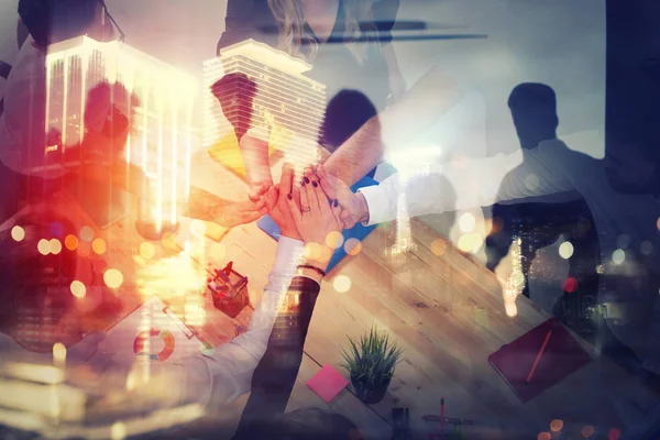 Handshaking business person in office. concept of teamwork and partnership. double exposure with light effects — Stock Photo, Image