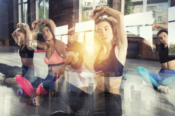 Young people do stretching at the gym. Double exposure — Stok fotoğraf