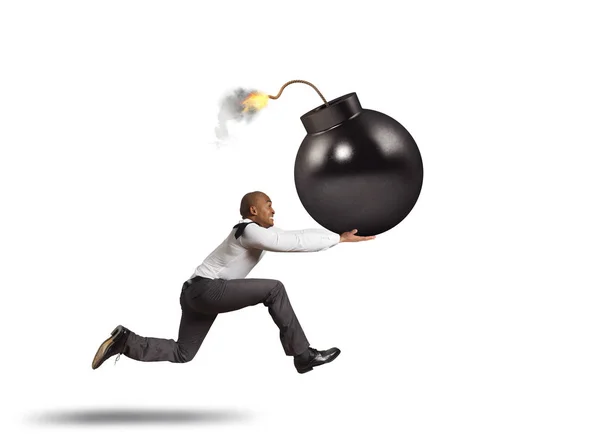 Business man in danger runs with a big bomb in his hand — Stock Photo, Image
