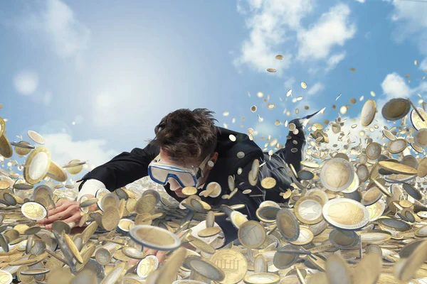 Businessman swims in a pool of money — Stock Photo, Image