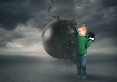 Power and determination of a child against a wrecking ball clipart