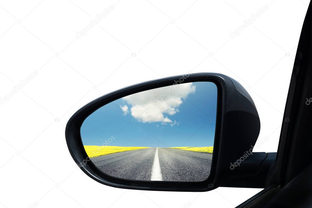 Wing mirror of a car with beautiful panorama reflected