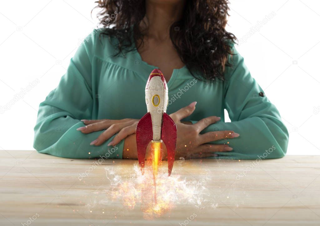 Businesswoman launches his company with a rocket. Concept of startup and innovation.