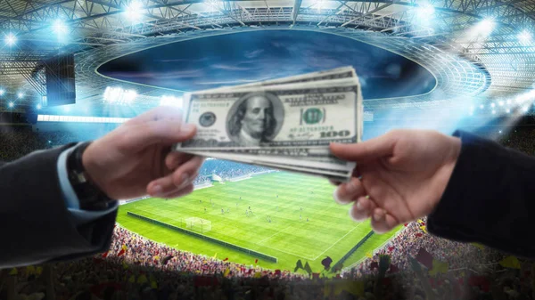 Transfer of money between two hands at the soccer stadium — Stock Photo, Image