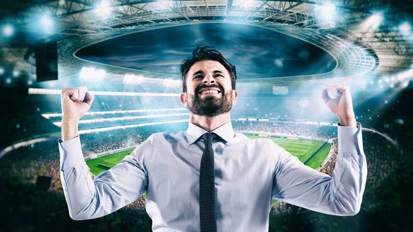 Man who rejoices at the stadium for winning a rich soccer bet — Stock Photo, Image