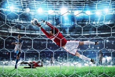 Kaleci bir futbol maçı sırasında topu stadyumda yakalar..
