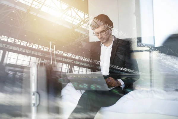 Traveler businessman with his laptop ready to fly. Double exposure