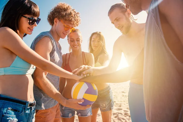 Group of friends that play beachvolley having fun on the beach