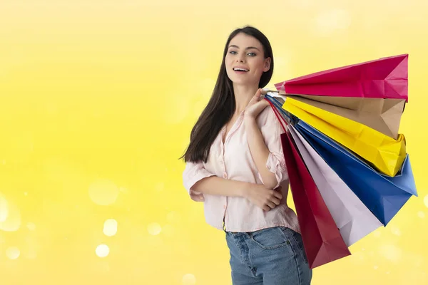 Happy woman with shopping bags in hand — Stock Photo, Image