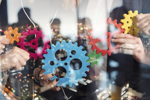 Business team connect pieces of gears. Teamwork, partnership and integration concept. double exposure — Stock Photo, Image