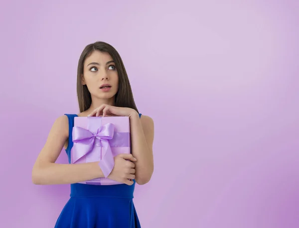 Happy woman think about her received present — Stock Photo, Image