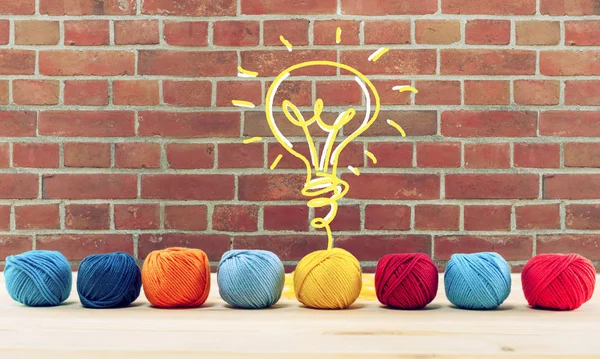 Concept of idea and innovation with wool ball that shapes a lightbulb — Stock Photo, Image