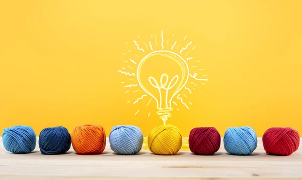 Concept of idea and innovation with wool ball that shapes a lightbulb