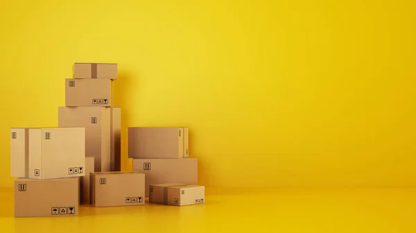 Stapel von Kartons auf dem Boden vor gelbem Hintergrund — Stockfoto