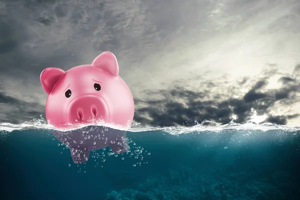 Lonely piggy bank sails in bad waters due to the crisis — Stock Photo, Image