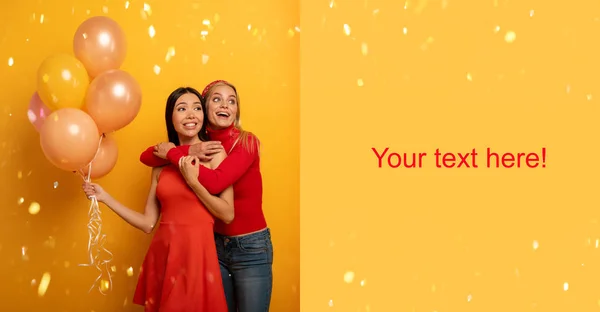 Girls ready for a party with balloons. Joyful an happiness expression. Yellow background. Space for your text. — Stock Photo, Image