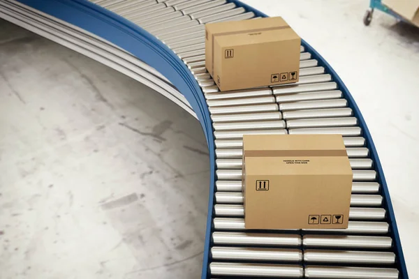 Cardboard boxes on conveyor rollers ready to be shipped by courier for distribution — Stock Photo, Image