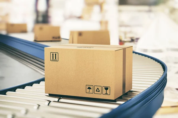 Kartonnen dozen op transportrollen klaar voor verzending per koerier voor distributie — Stockfoto