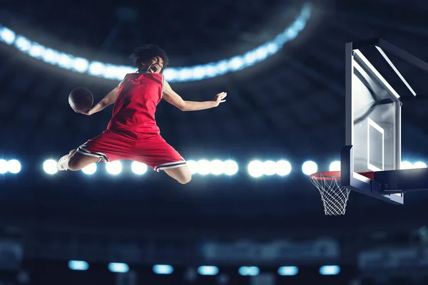 Acrobatic slam dunk de um jogador de cesta na cesta no estádio — Fotografia de Stock