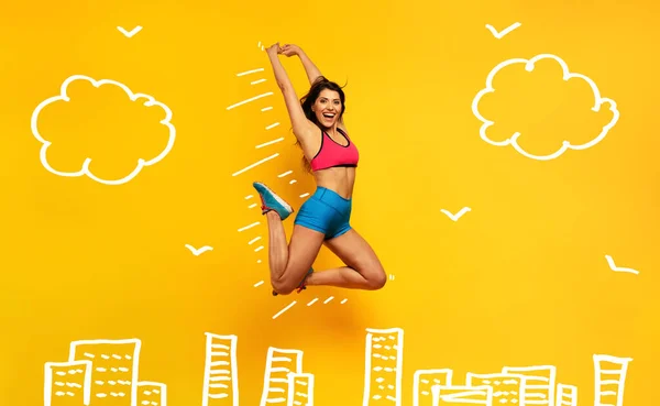 Sport woman jumps on a yellow background. Happy and joyful expression. — Stock Photo, Image