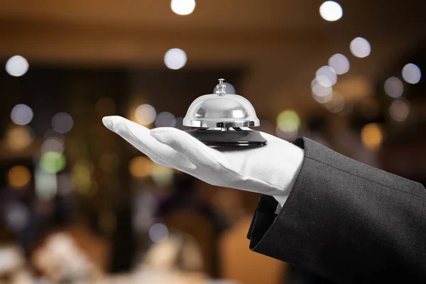 Waiter with bell in hand. Concept of first class service in your restourant. — Stock Photo, Image