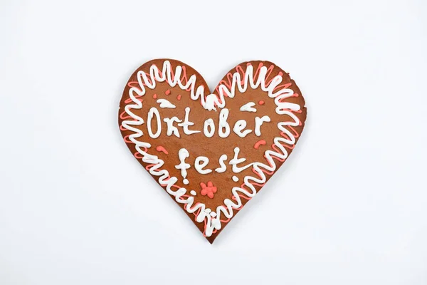 The gingerbread heart with Oktoberfest inscription on white background — Stock Photo, Image